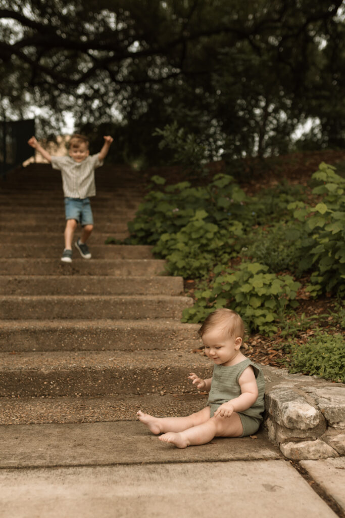 brothers playing on steps