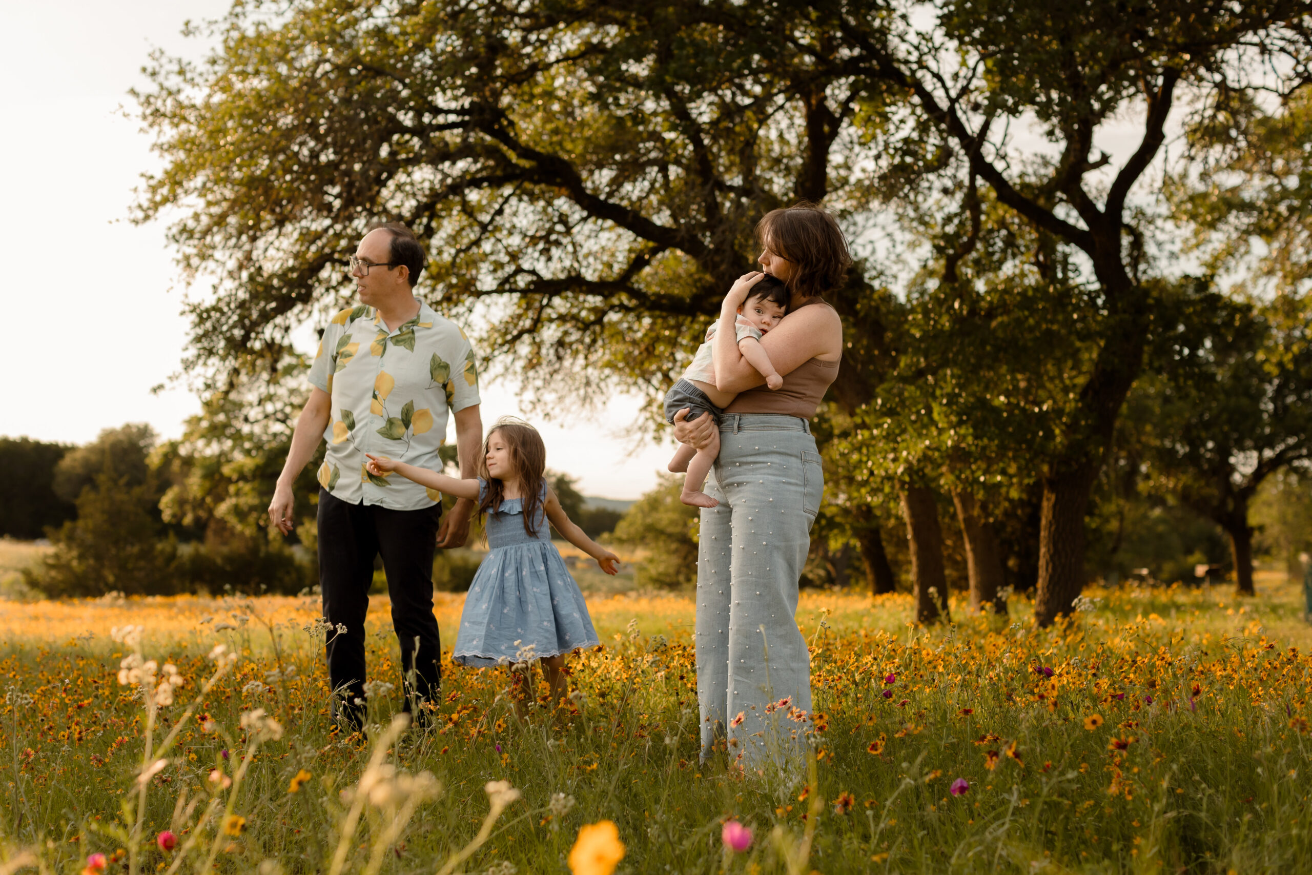 family of four among wildflowers