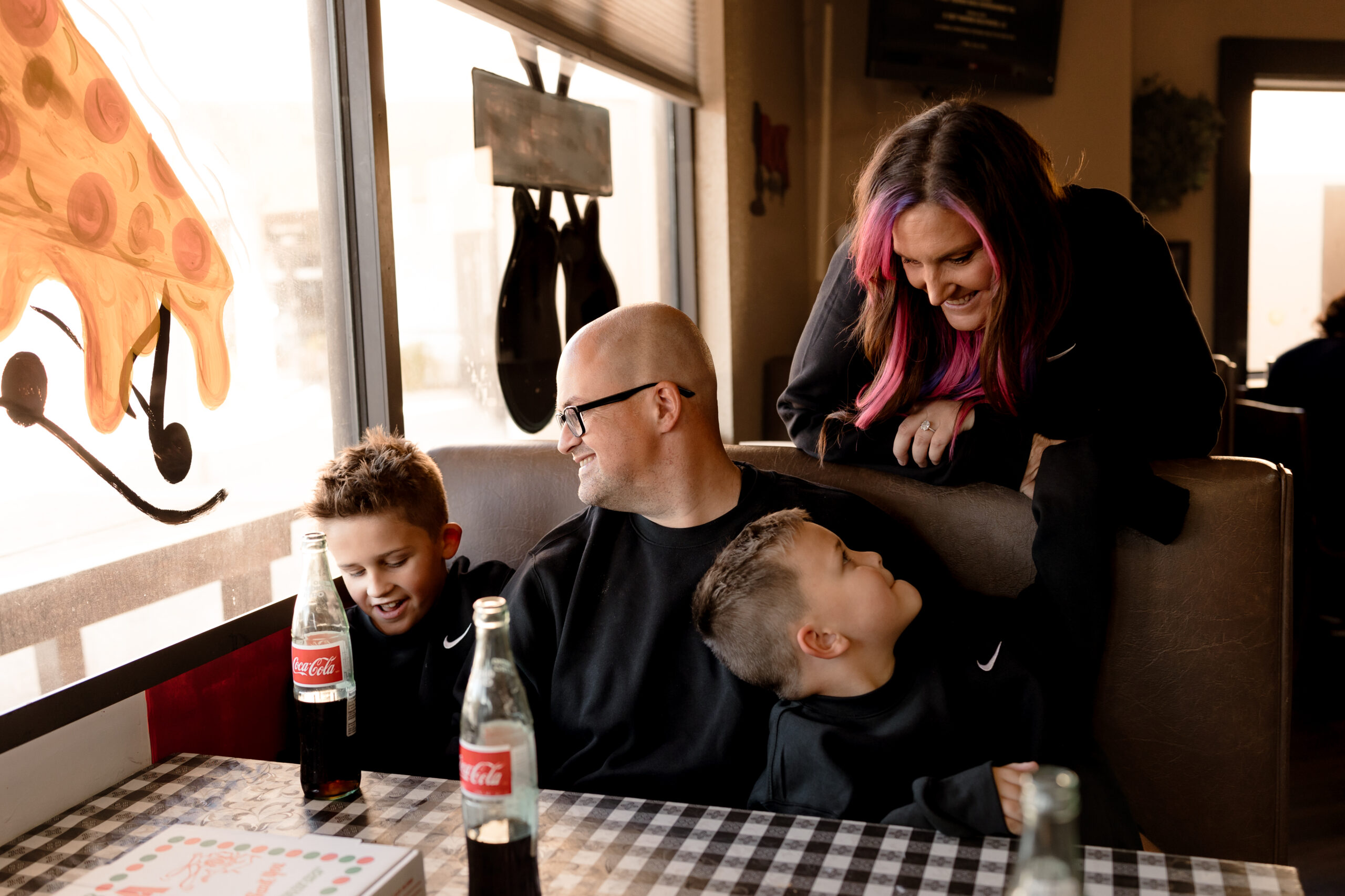 documentary family photo session at pizzaeria