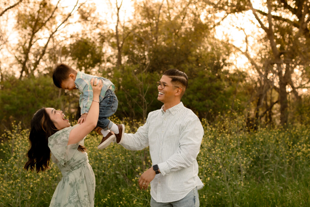family of three playing at family photo session