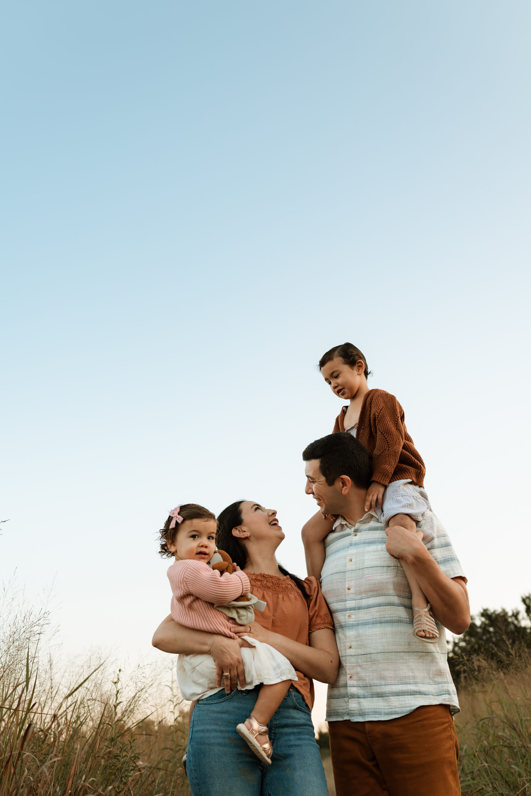 family of four during a lifestyle family photo session at Cibolo Nature Center in Boerne, Texas