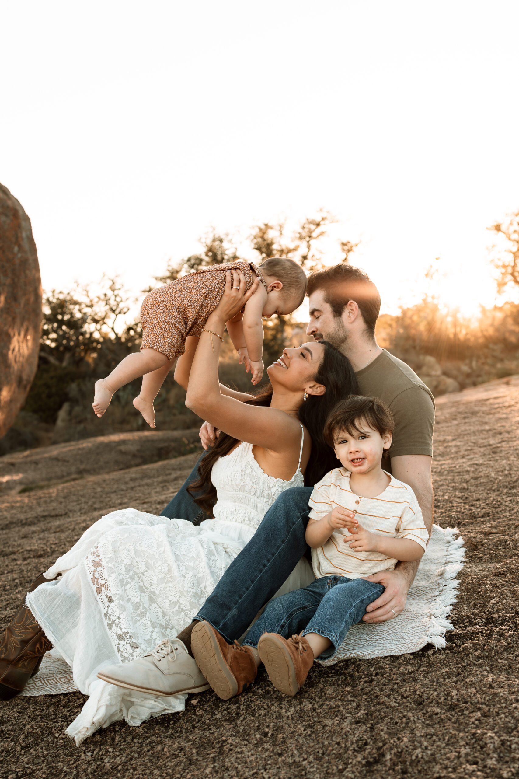 family of four at enchanted rock for family photos
