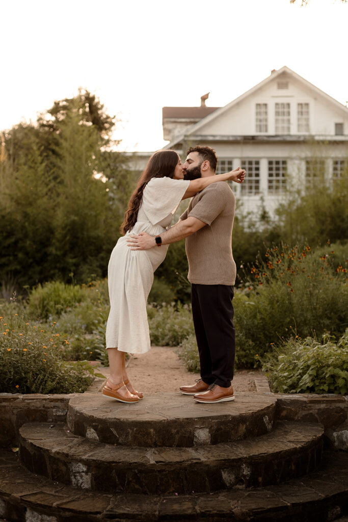 maternity photo of mom and dad in a garden
